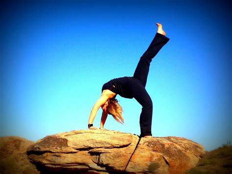 Flexible Woman Doing Single Leg Back Bridge Yoga Pose