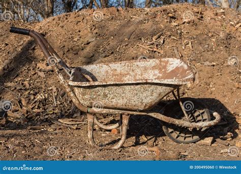 Old Rusty Wheelbarrow In The Field Stock Photo Image Of Work Vintage