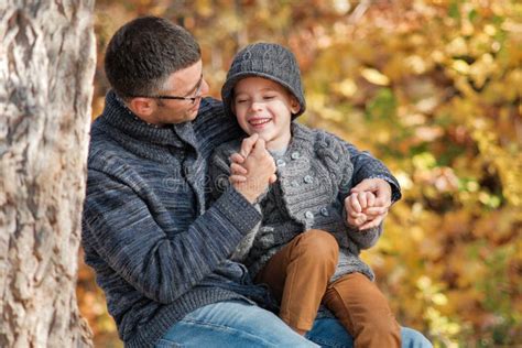 Father And Son Happy Together Outdoors On A Sunny Day Stock Image