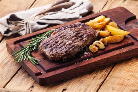 Medium Rare Grilled Steak Ribeye Stock Photo Image Of Board Cutting