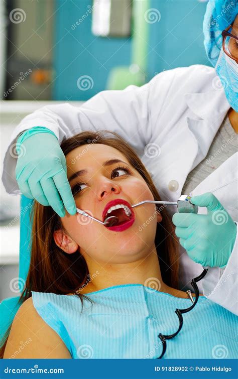 Beautiful Woman Patient Having Dental Treatment At Dentist`s Office