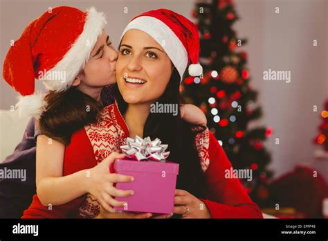 Daughter Giving Her Mother A Christmas Present Stock Photo Alamy