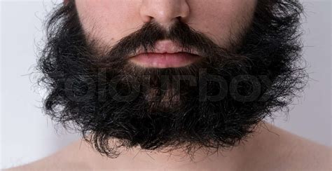 A Part Of A Long Ungroomed Beard With Long Messy And Untrimmed Hair