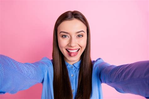 Premium Photo Self Photo Of Cheerful Woman Taking Selfie Showing Tongue