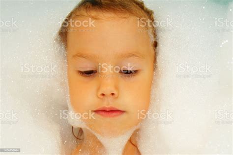 Little Sweet Girl Takes Bath With Bath Foam Funny Expression Joy On