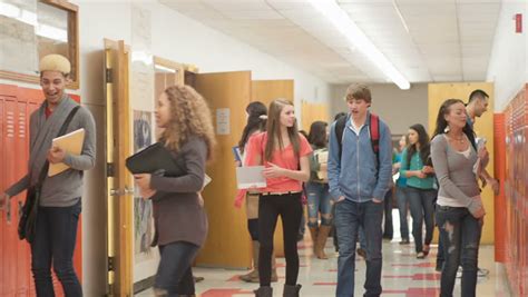 Time Lapse Of Busy Students And Teachers Walking Through The Hallway Of