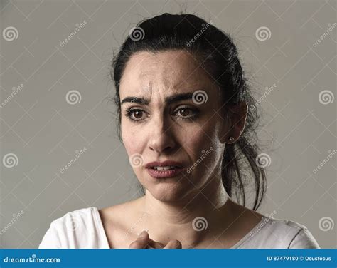 Beautiful And Sad Woman Crying Desperate And Depressed With Tears On