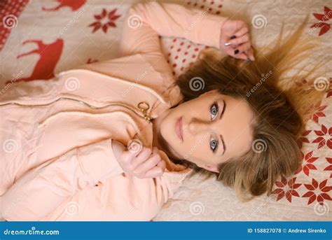 Beautiful Girl Lying On Her Back In Bed Royalty Free Stock Image