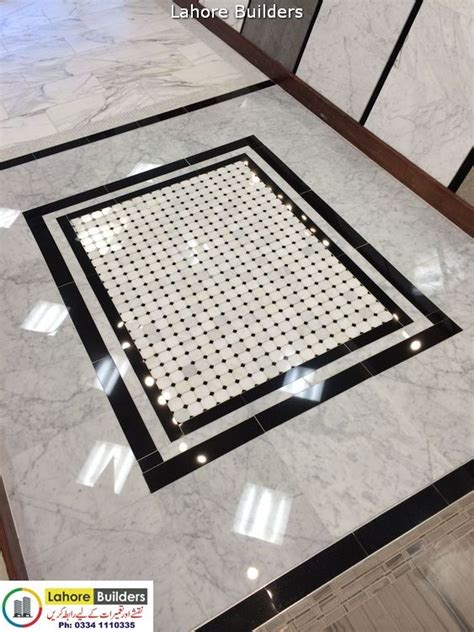 A Marble Floor With Black And White Designs On It