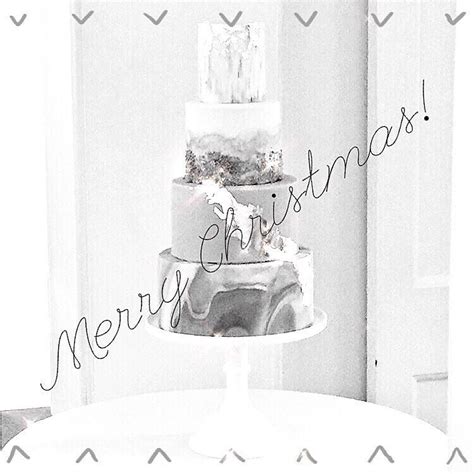 Black And White Photograph Of A Three Tiered Cake With The Words Merry