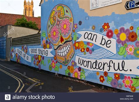 Street Art Graffiti Of A Skull With Slogan Too Much Of A Good Thing