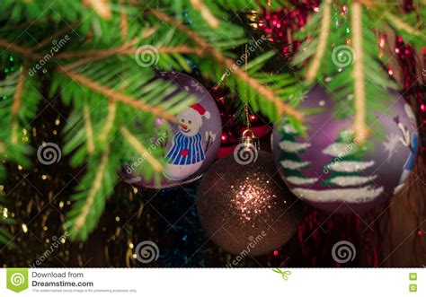 Christmas Tree Branches With Christmas Balls And Falling Snowflakes