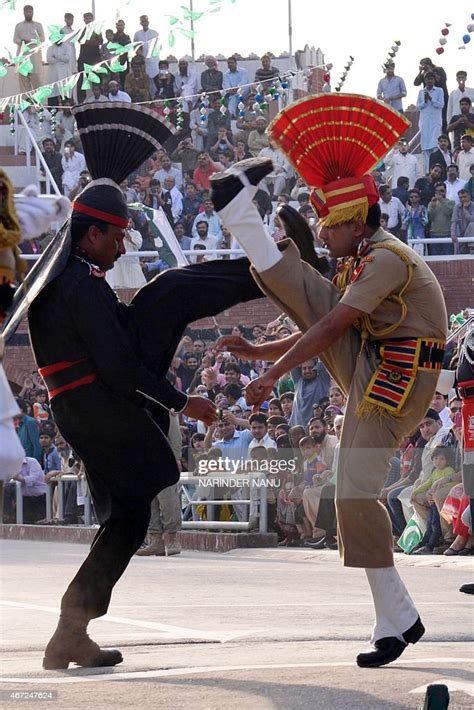 Pakistani Rangers And Indian Border Security Force Personnel Perform