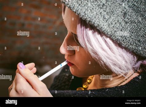Woman Lighting Cigarette Hi Res Stock Photography And Images Alamy