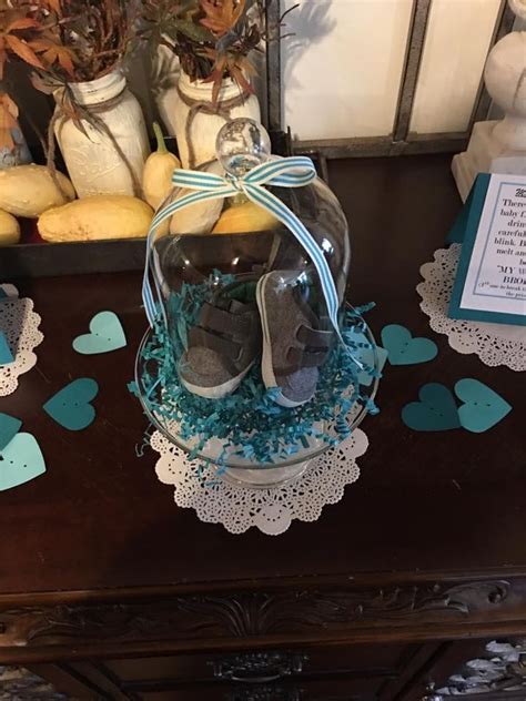 The wedding shoe game, bridal shower games hilarious. Little shoes under glass dome used to decorate for baby ...