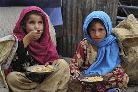 Afghan Children Eat A Meal Of Rice In Jalalabad June 2013 Os
