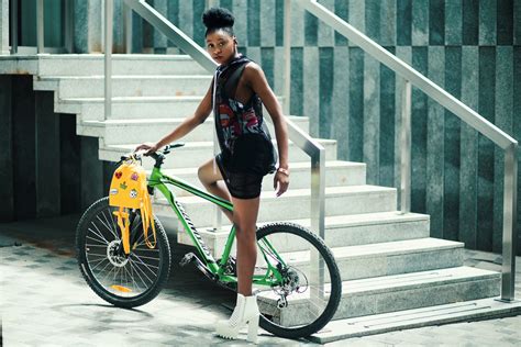 Free Photo Woman Wearing Black Dress Riding Bicycle Near Stairs African Seated Young Free