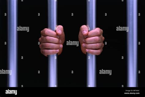 Hands On Prison Bars In Jail Gaol Fists Stock Photo 30894904 Alamy