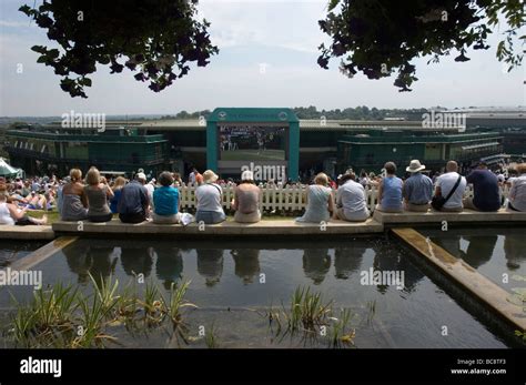 Female Spectators Watch The Tennis On The Big Screen At Wimbledon Stock