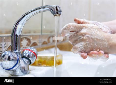 The Girl Washes Her Hands With Soap Under The Tap With Water Personal Hygiene Disinfection