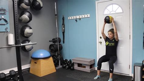 Wall Sit With Medicine Ball Overhead Press Youtube