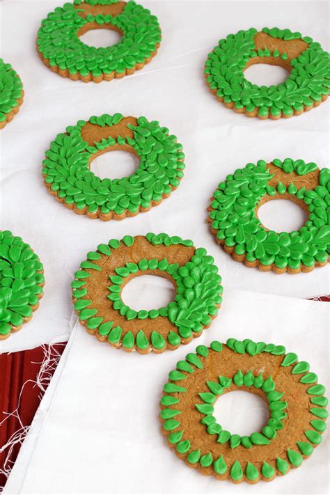You'll love the easy cookie recipe and the kids will love decorating each treat with a chocolate candy hat. Christmas Wreath Cookies | The Bearfoot Baker