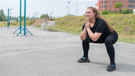 Fat Girl Is Engaged In Fitness On The Sports Field Beautiful Young