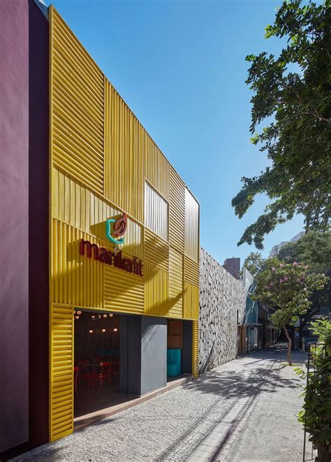 The Facade Of This New Restaurant Is A Bold Grid Of Yellow Aluminum