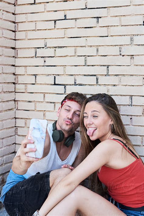 Lovely Couple Taking Selfies By Stocksy Contributor Ivan Gener Stocksy