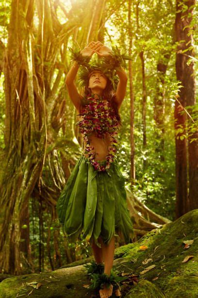 Asian Woman Performing Traditional Dance In Jungle Hawaiian Dancers