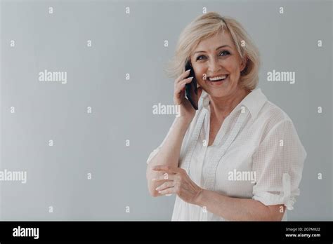Elderly Caucasian Old Aged Woman Portrait Gray Haired Portrait Enjoying Speaking Mobile Phone