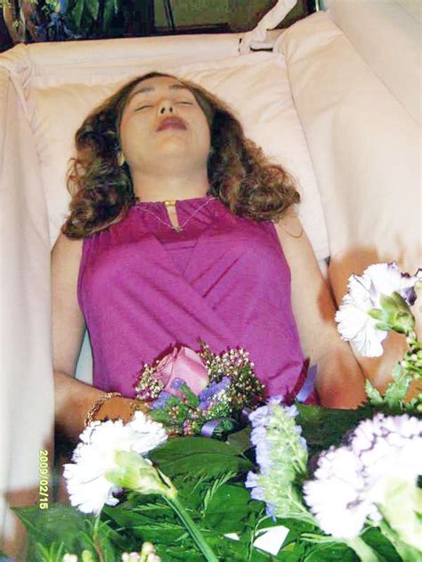 An American Woman In Her Open Casket During Her Funeral Dress