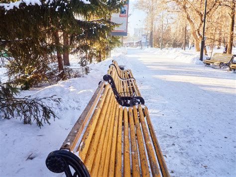 Benches In The Winter City Park Which Has Been Filled Up With Snow