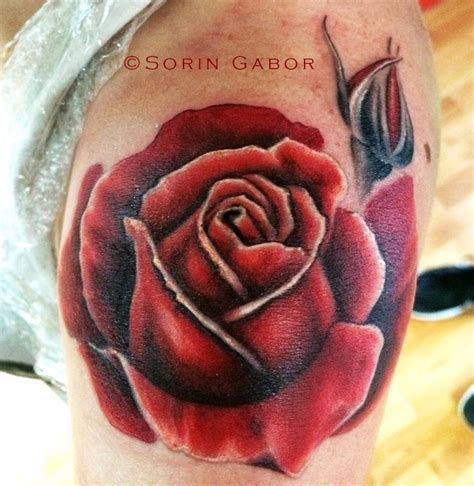 Do you have a specific design or color that you are interested in? realistic red rose tatoo on shoulder by Sorin Gabor : Tattoos
