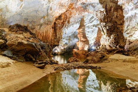 Beautiful Stalagmite Reflected In Water Inside Phong Nha Cave Stock