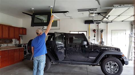 Never remove a lift cable while a door spring is under tension. Concealed Jeep hardtop lift with electric hoist | Jeep tops, Jeep hardtop storage, Jeep wrangler diy