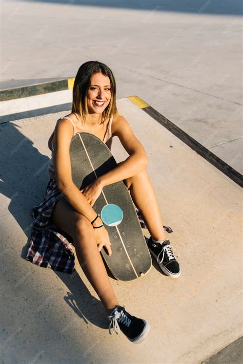 Free Photo Skater Girl Sitting And Smiling