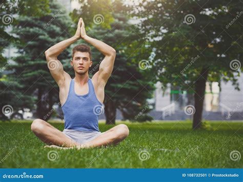 Young Man Practicing Yoga Sitting In Padmasana Stock Image Image Of