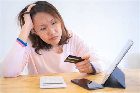 Confused PortraitÂ Young Woman Holding Credit Cards Having Problem