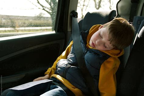 Boy Asleep In Car Backseat By Stocksy Contributor Kirsty Begg Stocksy