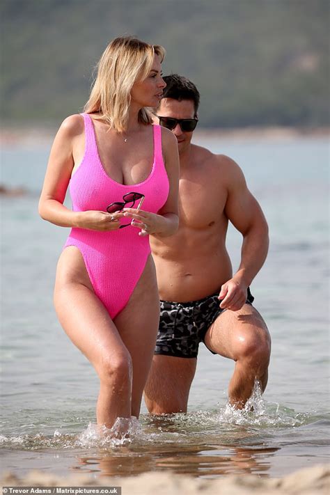 Rhian Sugden Flaunts Her Eye Popping Curves In Hot Pink Swimsuit