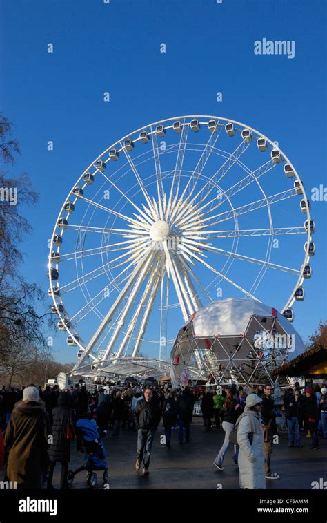Visitors At The Winter Wonderland Funfair Below The Wheel Of Hyde Park