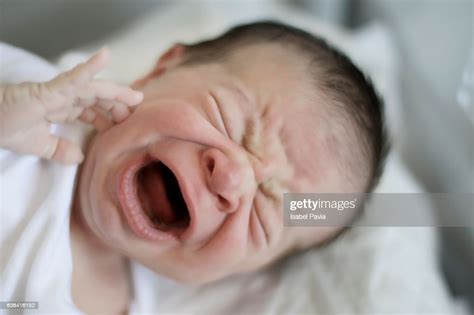 Newborn Baby Crying In Hospital Crib First Day High Res Stock Photo