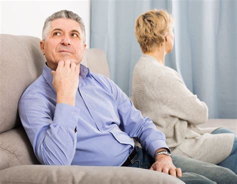 Disappointed Mature Couple Quarreling At Home With Each Other Stock Image Image Of Pride