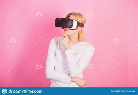 Young Woman Using A Virtual Reality Headset Happy Woman Exploring Augmented World Interacting