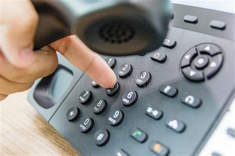 Closeup Of Man Finger Is Dialing A Telephone Number Stock Image Image