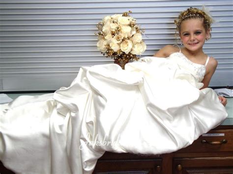 This Floor Length Flower Girl Dress Matches The Brides Dress