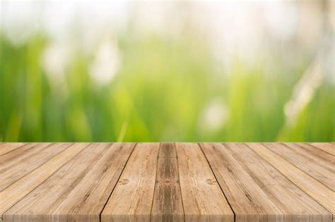 Wooden Board With Unfocused Nature Background Photo Free Download