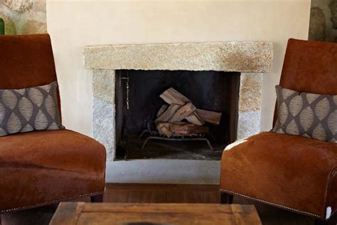 Asymmetrical Fireplace Surround Made Of Stone Slabs Hgtv