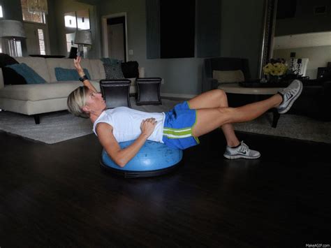 A Woman Is Doing Exercises On An Exercise Ball